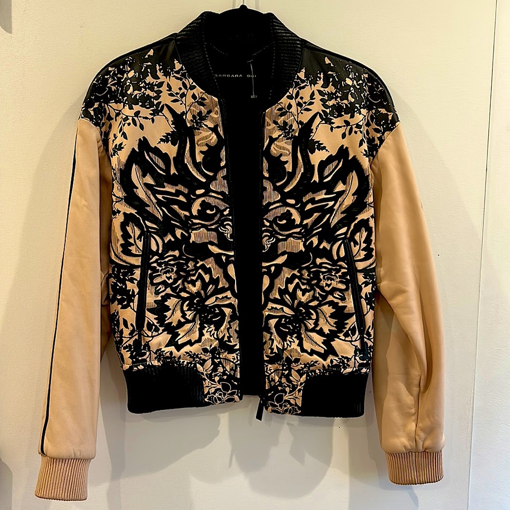Super buttery soft leather bomber jacket with calf hair appliqué.